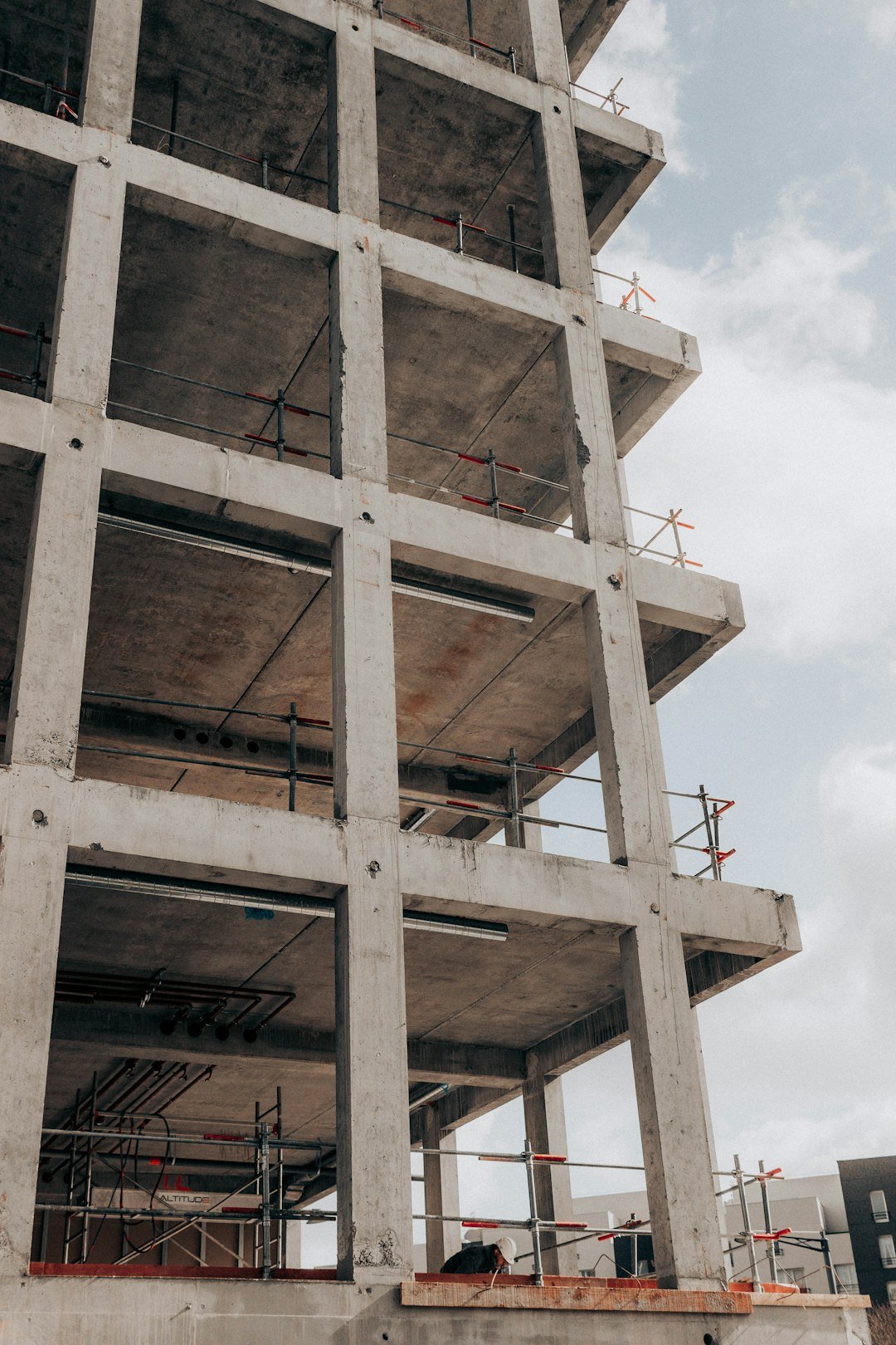 brown-concrete-building-under-white-clouds-during-daytime-bhcth6b8hda