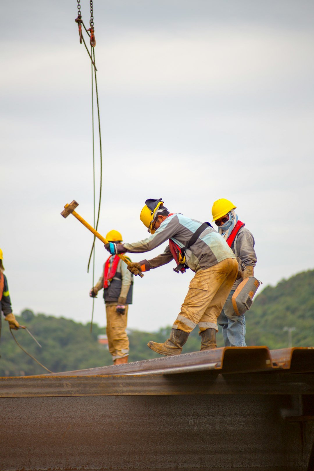 construction-worker-men-holding-hammer-fyd54gvxfgm